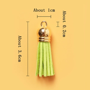 Light green faux suede tassel with gold cap and detailed size dimensions displayed