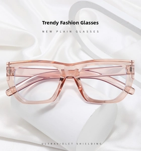 Detail of pink transparent oversized glasses frames with silver metal rivets on sides