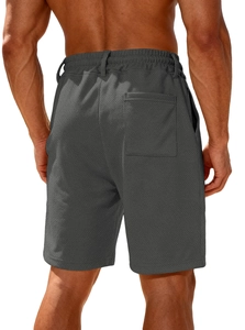 Detail view of men's dark grey shorts showing waffle knit texture and back pocket