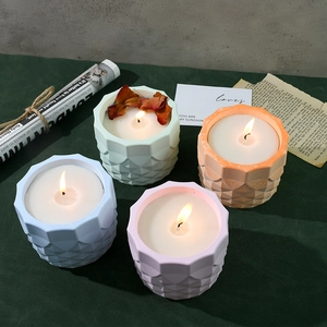 Scented candle resin mold set featuring four geometric cylinders with dried flower accents