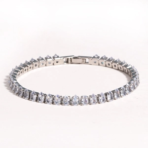 Detailed close-up of a silver bracelet with pear-shaped cubic zirconia and a secure clasp