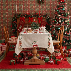 Christmas tablecloth with Santa Claus embroidery on a festive table setting