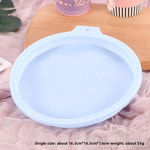 Macro shot of 3-cavity light blue silicone cake mold with 16.3x16.3cm size details