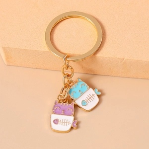 Cute cartoon cat in pot keychain with purple and blue kittens in white cups