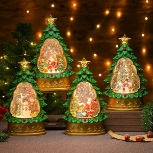 Detailed view of glowing Christmas tree snow globes with festive Santa and snowman scenes
