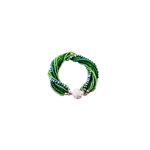 Multi-strand green beaded necklace with sparkling silver diamond-set sphere clasp