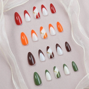 Detailed set of 20 almond-shaped press-on nails with colorful abstract French designs