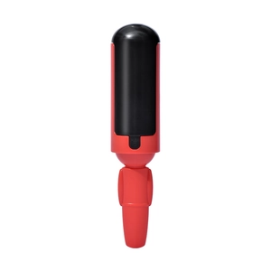 Dual-sided pet hair remover tool in red and black plastic with push button release mechanism