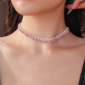 Close-up of luxury choker necklace with pink rectangular crystals on model's neck