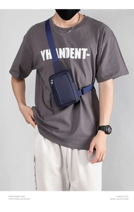 Close-up of a blue waterproof shoulder bag featuring durable nylon and stylish zippers