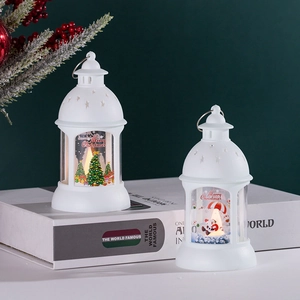 White Christmas LED lantern with Santa and tree patterns on decorative books