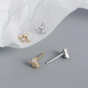 Detailed macro view of S925 silver stud earrings with square zircon in gold and silver