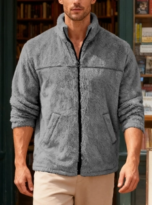 Detail of gray fleece jacket with stand collar and zipper in a library setting