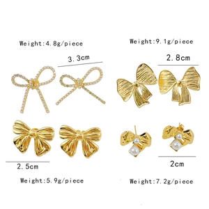 Golden bow earrings set with pearls and rhinestones in various fashionable styles