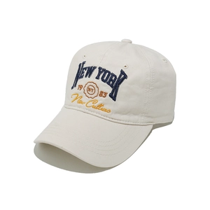 Detail of New York 1983 embroidery on off-white cotton twill baseball cap fabric