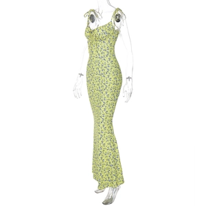 Detail view of floral summer dress with adjustable shoulder straps and yellow blue pattern