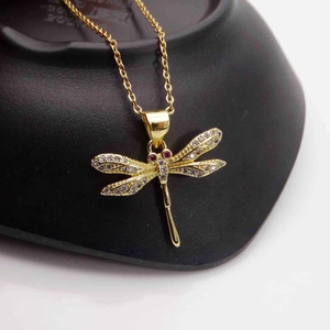 14k gold plated dragonfly pendant necklace with sparkling cubic zirconia and red eyes