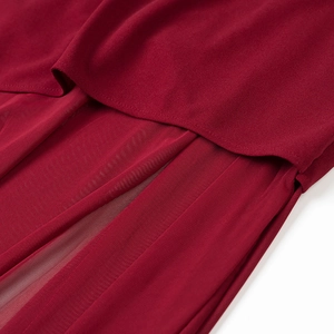 Detailed macro view of dark red chiffon fabric with delicate mesh splicing and layered sewing