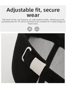 Detail of black baseball cap showing the adjustable metal buckle and rear strap closure