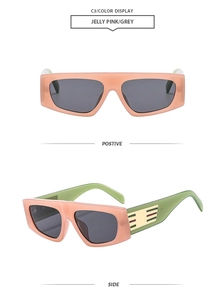 Detail view of pink jelly frame sunglasses with green temples and gold metal accents