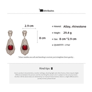 Detailed specs of vintage geometric silver needle earrings with red stones, 8cm x 2.9cm