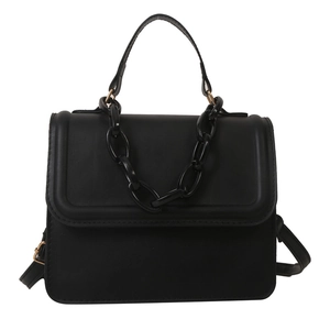 Minimalist black square crossbody bag with chunky chain detail and top handle