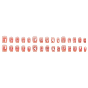 Pink gradient press-on nails with 3D heart charms, silver chains and white swirl patterns