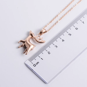 Rose gold stainless steel deer pendant necklace with measurement scale on white background