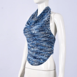 Detail of blue gradient knit halter top featuring shimmering silver sequins and textures
