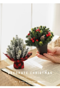 Detailed close-up of a 13cm mini Christmas tree with snow effect and red plaid cloth base