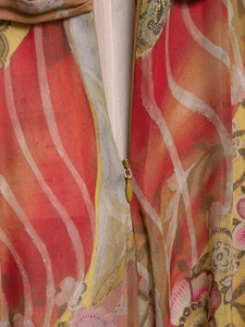 Detailed close-up of colorful floral print chiffon fabric with a hidden back zipper