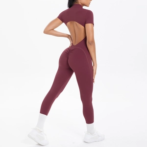 Deep burgundy short sleeve yoga jumpsuit featuring a heart-shaped back cutout and scrunch butt