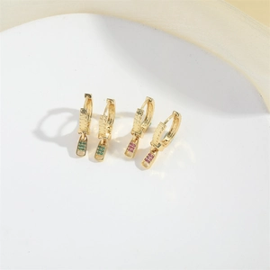 Luxury gold zipper earrings with green and red zircon stones on a white background