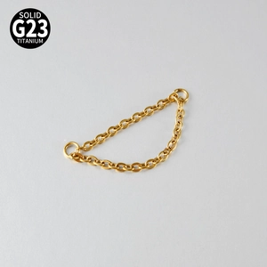 Macro detail of G23 titanium golden double layer chain for nose ring piercing jewelry