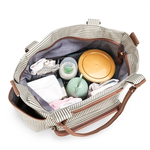 Grey and white striped diaper bag set showing spacious interior with multiple pockets