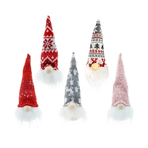 Detail showing glowing LED noses on assorted fabric Christmas gnome ornaments