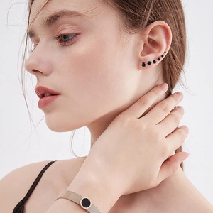 Close-up of six-piece black zircon crown ear stud set on earlobe and cartilage