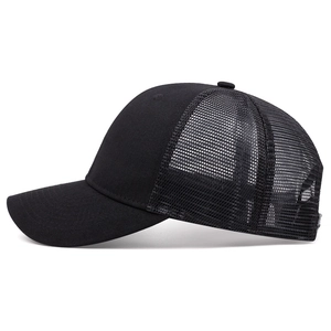 Side view of black mesh trucker hat featuring breathable net and curved brim detail