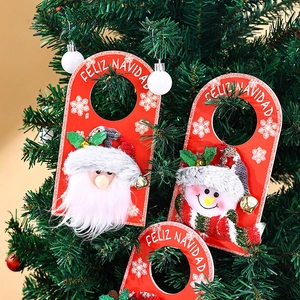 Christmas door hanger featuring Santa and Snowman with bells for holiday decor