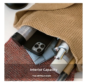 Internal view of khaki knitted tote bag showing large capacity for essentials