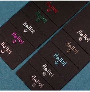 Detailed view of black paper display cards with metallic foil stamp and Hello text
