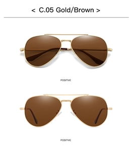 Close-up of golden aviator sunglasses with brown polarized lenses and double-bridge metal frame
