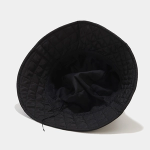 Black quilted bucket hat with interior diamond stitching and adjustable drawstring
