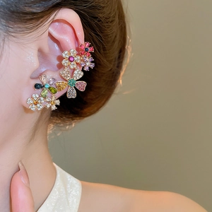 Detail view of 18k gold plated floral ear cuff featuring vibrant multicolored crystals