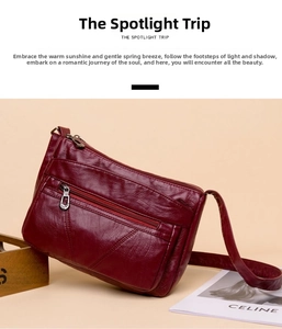 Détail du sac à bandoulière en cuir PU bordeaux avec plusieurs fermetures éclair en métal