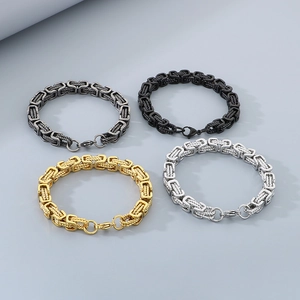 Detail of Byzantine box chain bracelets in silver, gold, and black stainless steel finishes
