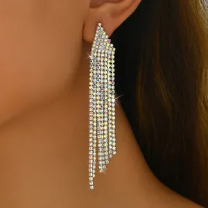 Close-up of cascading rainbow rhinestone fringe earrings on model for gala events
