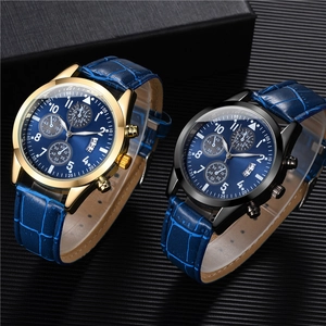 Detailed close-up of blue sunray dial luxury men watches with leather strap and sub-dials