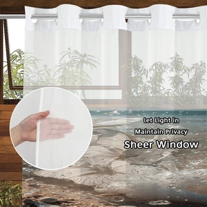Detail showing semi-transparent sheer curtain with butterfly print and silver metal rings