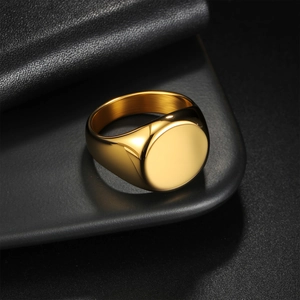 Minimalist gold-plated stainless steel signet ring with a polished round mirror surface